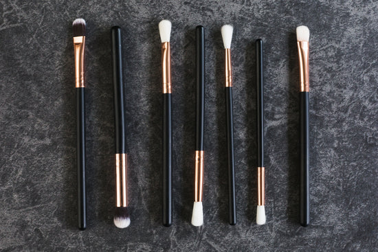 Seven black and gold eyeshadow brushes